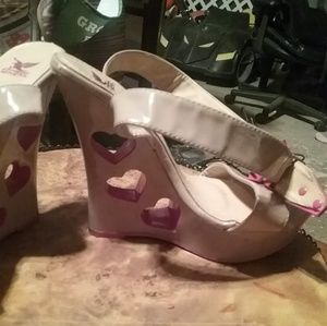 Beige/cream colored wedge heels with hearts cut ou